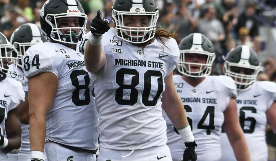 Michigan State tight end Matt Seybert (80) gestures after scoring a touchdown against Northwestern during the second half of an NCAA college football game, Saturday, Sept. 21, 2019, in Evanston, Ill. (AP Photo/David Banks)