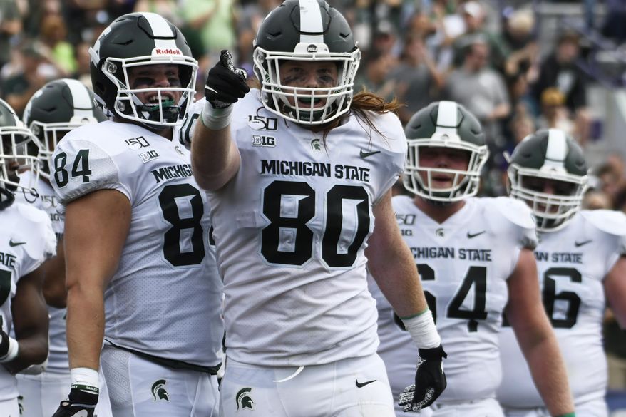 Michigan State tight end Matt Seybert (80) gestures after scoring a touchdown against Northwestern during the second half of an NCAA college football game, Saturday, Sept. 21, 2019, in Evanston, Ill. (AP Photo/David Banks)