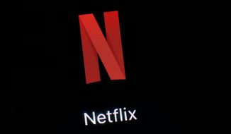 FILE- This March 19, 2018, file photo shows the Netflix app on an iPad in Baltimore. Shares of Netflix could open in negative territory for the year, the first time that’s happened since 2016, as major media players step into the stream to fight for subscribers. (AP Photo/Patrick Semansky, File)