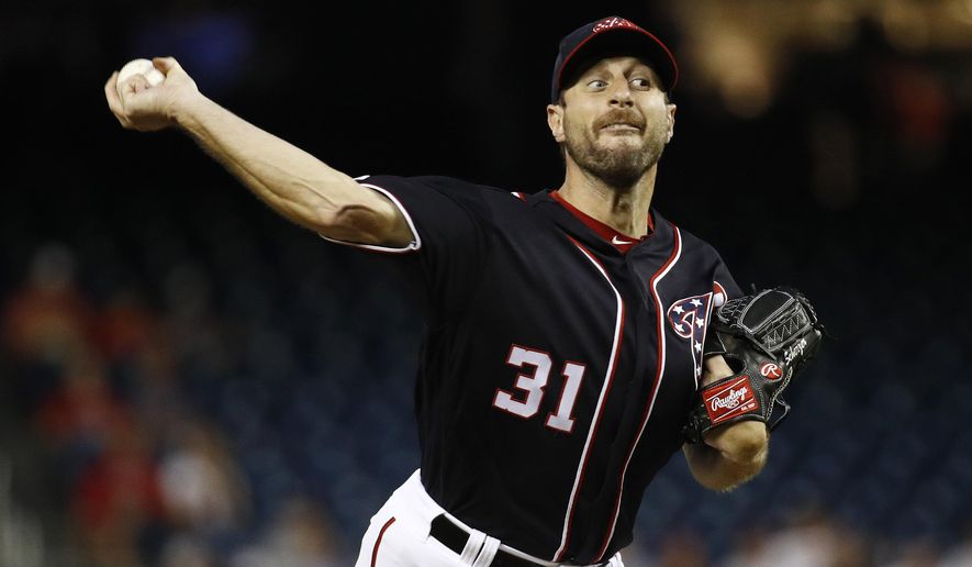 Washington Nationals starting pitcher Max Scherzer throws to the Philadelphia Phillies in the first inning of the second baseball game of a doubleheader, Tuesday, Sept. 24, 2019, in Washington. (AP Photo/Patrick Semansky)