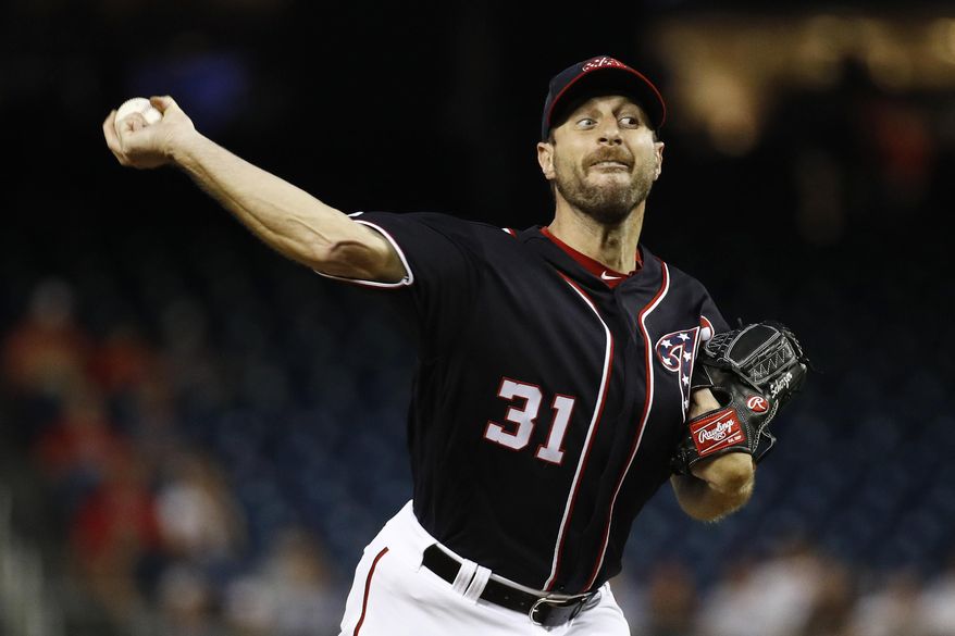 Washington Nationals starting pitcher Max Scherzer throws to the Philadelphia Phillies in the first inning of the second baseball game of a doubleheader, Tuesday, Sept. 24, 2019, in Washington. (AP Photo/Patrick Semansky)