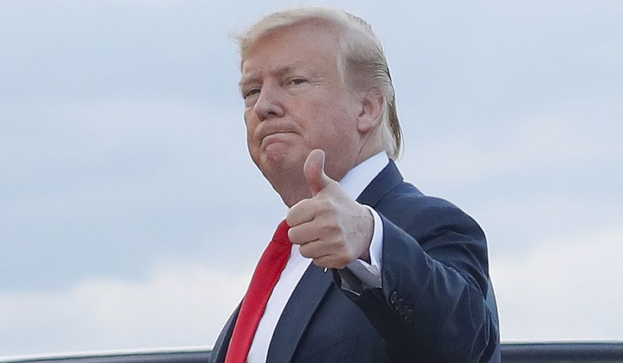 In this April 21, 2019, file photo, President Donald Trump gives a &quot;thumbs-up&quot; as he walks across the tarmac during his arrival on Air Force One at Andrews Air Force Base, Md. (AP Photo/Pablo Martinez Monsivais) ** FILE **