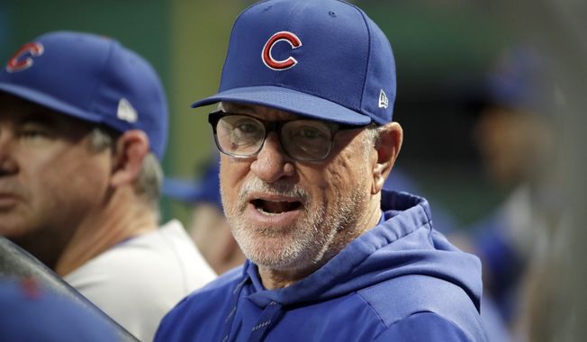 Chicago Cubs manager Joe Maddon stands in the dugout during the first inning of a baseball game against the Pittsburgh Pirates in Pittsburgh, Wednesday, Sept. 25, 2019. (AP Photo/Gene J. Puskar) ** FILE **