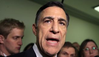FILE - In this Dec. 7, 2018 file photo Rep. Darrell Issa, R-Calif., speaks to reporters as he leaves a House Judiciary and Oversight Committee closed-door interview on Capitol Hill in Washington. Issa, the former California Rep. plans to run against indicted fellow GOP Congressman Duncan Hunter, The Associated Press has learned.(AP Photo/Manuel Balce Ceneta, File)