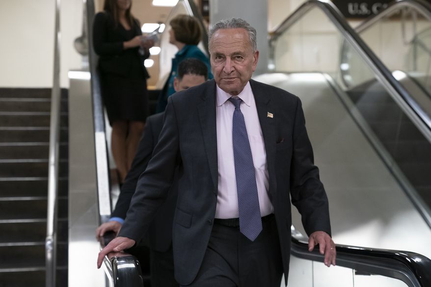 Senate Minority Leader Chuck Schumer, D-N.Y., and other senators head to a closed-door security briefing on Iran, at the Capitol in Washington, Wednesday, Sept. 25, 2019. (AP Photo/J. Scott Applewhite)