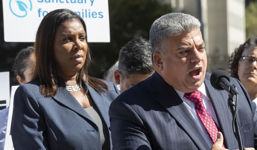 Brooklyn District Attorney Eric Gonzalez, right, is joined by New York State Attorney General Letitia James as he speaks during a news conference, Wednesday, Sept. 25, 2019, in New York. New York's attorney general has joined the Brooklyn district attorney and several advocates' groups in filing two lawsuits challenging immigration arrests in state courthouses. (AP Photo/Mary Altaffer)