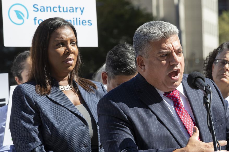 Brooklyn District Attorney Eric Gonzalez, right, is joined by New York State Attorney General Letitia James as he speaks during a news conference, Wednesday, Sept. 25, 2019, in New York. New York's attorney general has joined the Brooklyn district attorney and several advocates' groups in filing two lawsuits challenging immigration arrests in state courthouses. (AP Photo/Mary Altaffer)