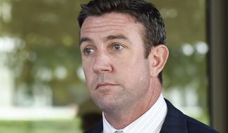Rep. Duncan Hunter leaves federal court after a motions hearing in San Diego. Former California Rep. Darrell Issa plans to run against indicted fellow GOP Congressman Hunter, The Associated Press has learned. (AP Photo/Denis Poroy,File)
