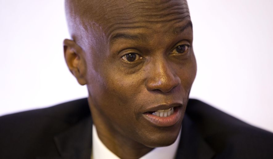 FILE - In this Aug. 28, 2019 file photo, Haiti's President Jovenel Moise speaks during an interview in his office in Port-au-Prince, Haiti. Moise is urging a pause in protests that have paralyzed the Caribbean nation. The Haitian leader appealed for calm and unity in a televised speech early Wednesday, Sept. 25, 2019, as he asked opponents to help his administration resolve the multiple problems Haiti is facing. (AP Photo/Dieu Nalio Chery, File)