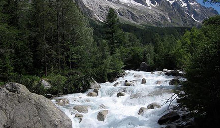 In this photo dated 2009, risk of part of the Planpincieux glacier breaking off amid climate warming in the Alps has prompted Italian authorities to forbid hikers and tourists from a section of the Val Ferrat area, shown in this June 2009 photo from the famed Tour du Mont Blanc trail outside Courmayeur, Italy. The fast-moving Italian glacier is melting quickly, threatening the picturesque valley near the Alpine town of Courmayeur and prompting Mayor Stefano Miserocchi to close down a mountain road. (AP Photo / Randall Hackley)
