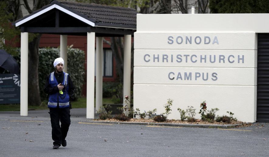 A security guard keeps watch outside student accommodation at Canterbury University in Christchurch, New Zealand, Wednesday, Sept. 25, 2019. New Zealand&#39;s education minister called for an investigation Wednesday after reports that a student&#39;s body lay undiscovered in a university dorm room for nearly eight weeks. (AP Photo/Mark Baker)