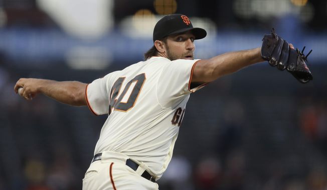 San Francisco Giants pitcher Madison Bumgarner works against the Colorado Rockies during the first inning of a baseball game Tuesday, Sept. 24, 2019, in San Francisco. (AP Photo/Ben Margot) ** FILE **