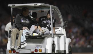 Colorado Rockies&#39; Jeff Hoffman leaves a baseball game on a cart with a leg injury after being hit by a ball batted by San Francisco Giants&#39; Alex Dickerson during the fourth inning Tuesday, Sept. 24, 2019, in San Francisco. (AP Photo/Ben Margot)