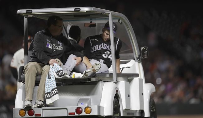 Colorado Rockies&#x27; Jeff Hoffman leaves a baseball game on a cart with a leg injury after being hit by a ball batted by San Francisco Giants&#x27; Alex Dickerson during the fourth inning Tuesday, Sept. 24, 2019, in San Francisco. (AP Photo/Ben Margot)