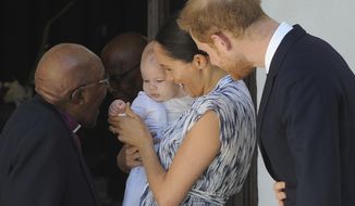 Britain&#39;s Prince Harry and Meghan, Duchess of Sussex, holding their son Archie, meets with Anglican Archbishop Emeritus, Desmond Tutu, in Cape Town, South Africa Wednesday, Sept. 25, 2019. The royal couple are on the third day of their African tour. (Henk Kruger/African News Agency via AP, Pool)