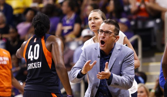 Connecticut Sun&#x27;s head coach Curt Miller, right, greets his players during a timeout in the second half of Game 3 of a WNBA basketball playoff game against the Los Angeles Sparks, Sunday, Sept. 22, 2019, in Long Beach, Calf. (AP Photo/Ringo H.W. Chiu) **FILE**