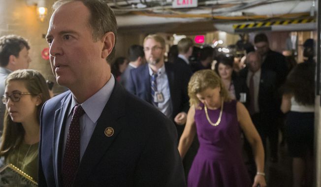 Rep. Adam Schiff, D-Calif., left, Chairman of the House Intelligence Committee departs with other House democrats after a caucus meeting, Tuesday, Sept. 24, 2019 in Washington. (AP Photo/Alex Brandon)