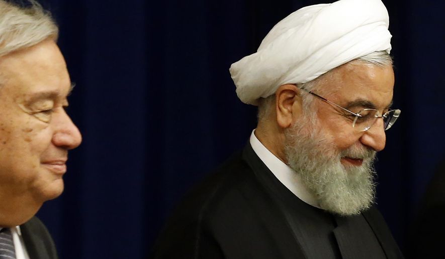 Iran's President Hassan Rouhani, right, meets with United Nations Secretary-General Antonio Guterres during the 74th session of the U.N. General Assembly, at U.N. headquarters, Wednesday, Sept. 25, 2019. (AP Photo/Jason DeCrow)