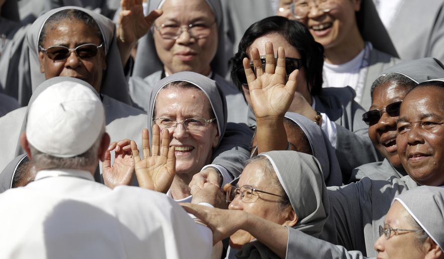 Pope Francis greets nuns during his weekly general audience in St. Peter's Square, at the Vatican, Wednesday, Sept. 25, 2019. (AP Photo/Gregorio Borgia)