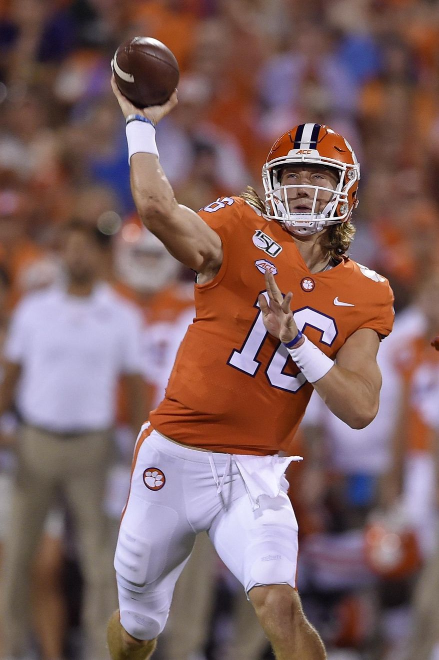 Clemson quarterback Trevor Lawrence throws a pass during the first half of the team's NCAA college football game against Charlotte on Saturday, Sept. 21, 2019, in Clemson, S.C. (AP Photo/Richard Shiro)