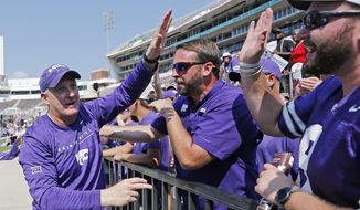 Kansas State head coach Chris Klieman is congratulated by fans following their NCAA college football game win 31-24 over Mississippi State in Starkville, Miss., Saturday, Sept. 14, 2019. (AP Photo/Rogelio V. Solis)