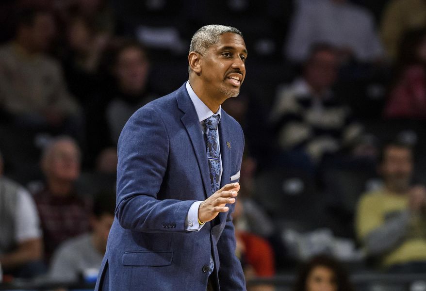 FILE - In this Saturday, Feb. 11, 2017, file photo, then-Georgia Tech assistant coach Darryl LaBarrie gestures during the first half of an NCAA basketball game against Boston College, in Atlanta. Georgia Tech's basketball team was banned from postseason play for the upcoming season and slapped with four years of probation for major recruiting violations committed by a former assistant coach and an ex-friend of head coach Josh Pastner. The NCAA says former assistant coach Darryl LaBarrie gave $300 to a highly touted prospect for a visit to an Atlanta strip club and arranged for him to meet with a former Georgia Tech athlete who played for the NBA's Atlanta Hawks, including a visit to the player's home and a free meal at a lounge owned by the player.(AP Photo/Danny Karnik, File)