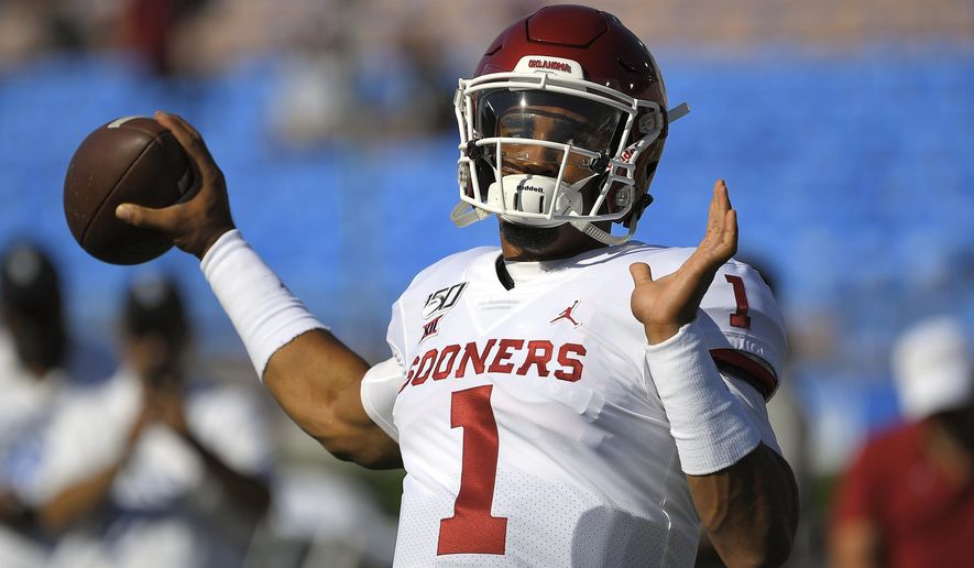 Oklahoma quarterback Jalen Hurts warms up for the team's NCAA college football game against UCLA on Saturday, Sept. 14, 2019, in Pasadena, Calif. (AP Photo/Mark J. Terrill)
