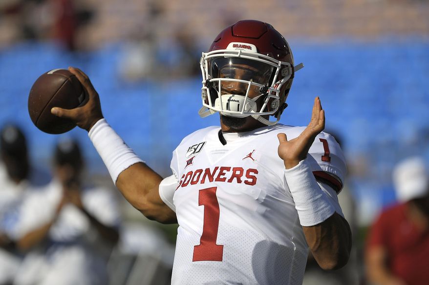 Oklahoma quarterback Jalen Hurts warms up for the team's NCAA college football game against UCLA on Saturday, Sept. 14, 2019, in Pasadena, Calif. (AP Photo/Mark J. Terrill)