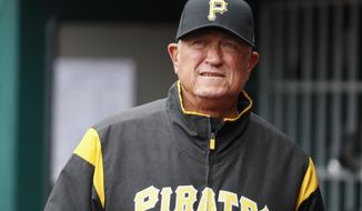 FILE - In this March 31, 2019, file photo, Pittsburgh Pirates manager Clint Hurdle walks through the dugout in the third inning of a baseball game against the Cincinnati Reds in Cincinnati. Hurdle hopes to return for what would be his 10th season as the Pirates’ manager in 2020. He  has two more years remaining on a deal that started with the 2018 season. (AP Photo/John Minchillo, File)