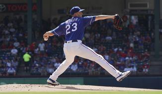 Texas Rangers starting pitcher Mike Minor (23) throws a pitch during the first inning of a baseball game against the Boston Red Sox on Thursday, Sept. 26, 2019, in Arlington, Texas. (AP Photo/Louis DeLuca)