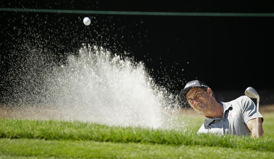 Adam Scott, of Australia, follows his shot out of a bunker onto the seventh green of the Silverado Resort North Course during the first round of the Safeway Open PGA golf tournament Thursday, Sept. 26, 2019, in Napa, Calif. (AP Photo/Eric Risberg)