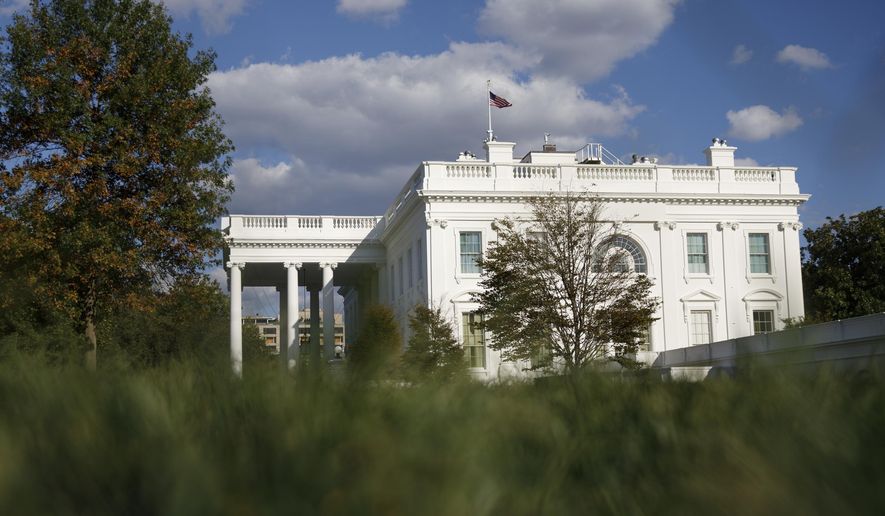 FILE - This Tuesday, Sept. 24, 2019, file photo shows the White House in Washington. The Democratic impeachment inquiry may give President Donald Trump extra motivation to end his trade war with China, claim credit for a policy victory and divert a little attention from a congressional investigation into his dealings with Ukraine. (AP Photo/Carolyn Kaster, File)