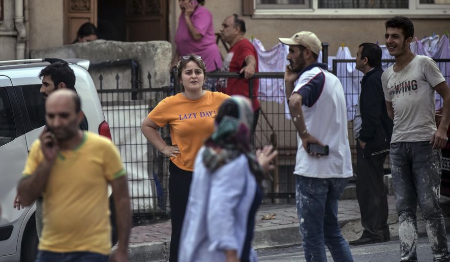 People stand on the streets after evacuating their homes, following an earthquake in Istanbul, Thursday, Sept. 26, 2019. Turkey&#39;s emergency authority says a 5.8 magnitude earthquake has shaken Istanbul with no immediate damage reported.   (DHA via AP)
