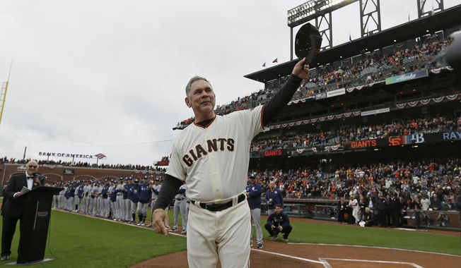 FILE - In this April 5, 2019, file photo, San Francisco Giants manager Bruce Bochy tips his cap to the crowd during introductions before the team&#x27;s baseball game against the Tampa Bay Rays in San Francisco. Just as important to Bochy as capturing those three World Series titles in five years managing the Giants is his fairness and genuine way in dealing with the players who have helped him win during a decorated career on the dugout&#x27;s top step. Everybody wants to do their best for the 64-year-old Bochy as he wraps up an accomplished 25-year managerial career that featured his first 12 seasons in San Diego and the last 13 with San Francisco. (AP Photo/Eric Risberg, File)