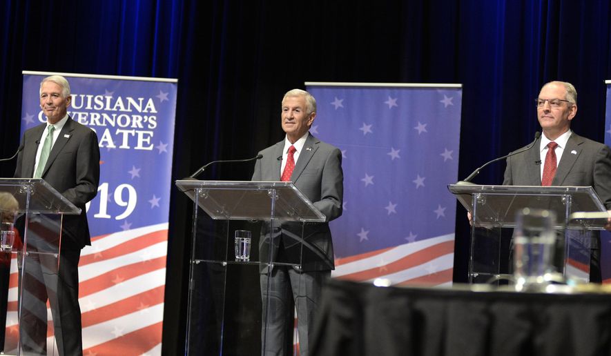 Gubernatorial candidates, from left, U.S. Rep. Ralph Abraham, Eddie Rispone, and Gov. John Bel Edwards, face each other in the second debate, hosted by Louisiana Public Broadcasting, on Thursday, Sept. 26, 2019, at Angelle Hall on the campus of the University of Louisiana at Lafayette in Lafayette, La.  (Brad Bowie /The Daily Advertiser via AP)