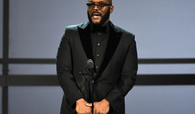 FILE - This June 23, 2019 file photo shows Tyler Perry accepting the ultimate icon award at the BET Awards in Los Angeles. Perry says he cannot “just up and leave” filming in Georgia despite Hollywood’s backlash against the state’s “heartbeat” abortion law. Perry made the remarks Friday, Sept. 27, while discussing the upcoming opening of a massive new Atlanta-based studio. Some celebs have urged TV and film companies to abandon the state after Republican Gov. Brian Kemp signed the restrictive abortion bill in May. (Photo by Chris Pizzello/Invision/AP, File)