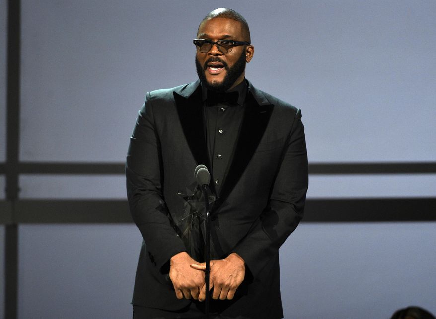 FILE - This June 23, 2019 file photo shows Tyler Perry accepting the ultimate icon award at the BET Awards in Los Angeles. Perry says he cannot “just up and leave” filming in Georgia despite Hollywood’s backlash against the state’s “heartbeat” abortion law. Perry made the remarks Friday, Sept. 27, while discussing the upcoming opening of a massive new Atlanta-based studio. Some celebs have urged TV and film companies to abandon the state after Republican Gov. Brian Kemp signed the restrictive abortion bill in May. (Photo by Chris Pizzello/Invision/AP, File)