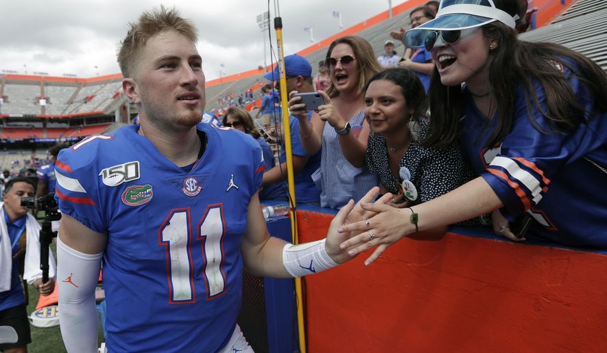Florida quarterback Kyle Trask (11) celebrates with fans after defeating Tennessee in an NCAA college football game, Saturday, Sept. 21, 2019, in Gainesville, Fla. (AP Photo/John Raoux)