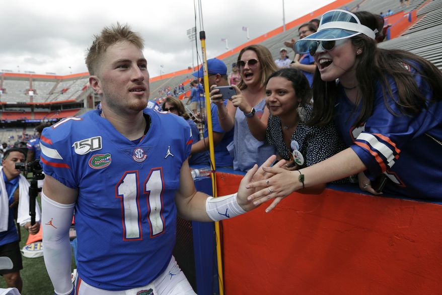 Florida quarterback Kyle Trask (11) celebrates with fans after defeating Tennessee in an NCAA college football game, Saturday, Sept. 21, 2019, in Gainesville, Fla. (AP Photo/John Raoux)