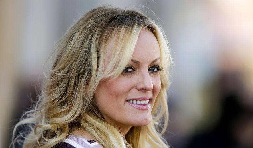 In this Oct. 11, 2018, file photo, adult film actress Stormy Daniels attends the opening of the adult entertainment fair &quot;Venus&quot; in Berlin, Germany. (AP Photo/Markus Schreiber, File)