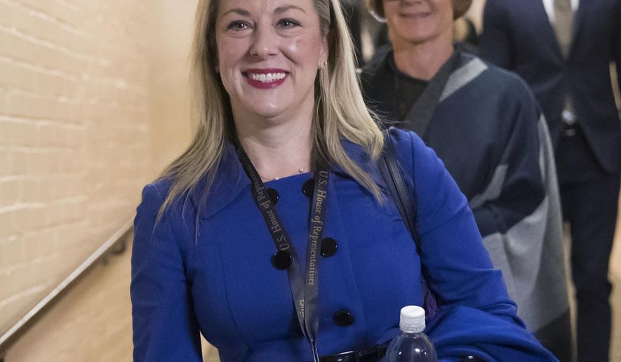 FILE - In this Nov. 15, 2018, file photo, then Rep.-elect Kendra Horn, D-Okla., walks through the basement of the Capitol in Washington. Horn is among the Democrats in swing districts who find themselves in a tight spot as the House opens an impeachment inquiry related to President Donald Trump&#39;s request for a foreign leader to dig up dirt on a political rival. (AP Photo/J. Scott Applewhite, File)