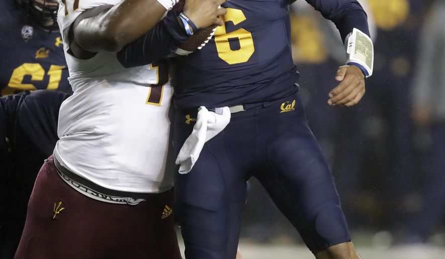 Arizona State's George Lea, left, tackles California quarterback Devon Modster (6) in the first half of an NCAA college football game, Friday, Sept. 27, 2019, in Berkeley, Calif. (AP Photo/Ben Margot)