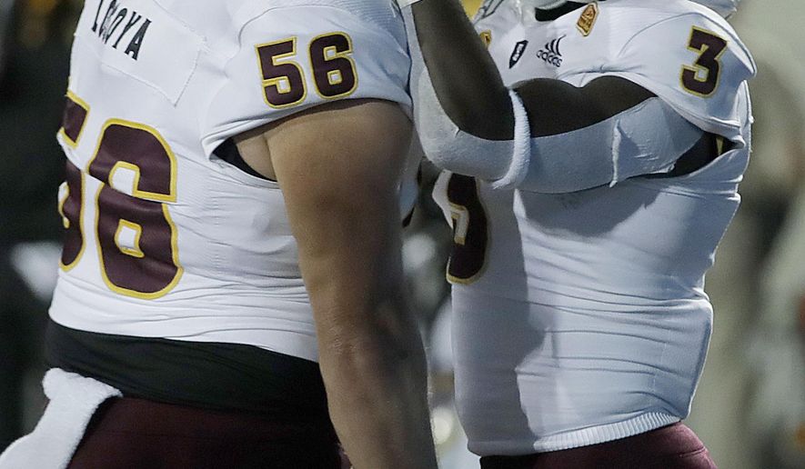 Arizona State's Eno Benjamin, right, celebrates with Alex Losoya (56) after scoring a touchdown against California in the first half of an NCAA college football game, Friday, Sept. 27, 2019, in Berkeley, Calif. (AP Photo/Ben Margot)