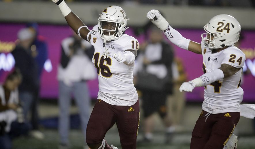 Arizona State's Aashari Crosswell, left, celebrates with Chase Lucas (24) after intercepting a pass intended for California's Jordan Duncan in the first half of an NCAA college football game, Friday, Sept. 27, 2019, in Berkeley, Calif. (AP Photo/Ben Margot)
