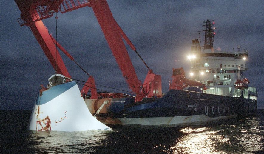 FILE - In this file photo dated Finland, Nov. 19, 1994, the bow door of the sunken passenger ferry M/S Estonia is lifted up from the bottom of the sea, off Uto Island, in the Baltic Sea. Estonia and Sweden on Saturday Sept. 28, 2019, are marking the 25th anniversary of the disaster that claimed 852 lives when the passenger ferry en route from Tallinn to Stockholm sank in a heavy storm. (Jaakko Aiikainen/Lehtikuva FILE via AP)