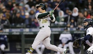 Oakland Athletics&#39; Ramon Laureano hits a solo home run on a pitch from Seattle Mariners starting pitcher Marco Gonzales during the third inning of a baseball game, Saturday, Sept. 28, 2019, in Seattle. (AP Photo/John Froschauer)