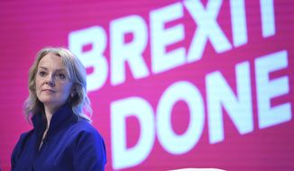 Britain&#39;s International Trade Secretary Liz Truss on stage at the Conservative Party Conference being held in Manchester, England, Sunday Sept.29, 2019.  The Conservative Party is committed to Britain&#39;s Brexit split from the European Union  leaving on the scheduled date of Oct. 31. (Stefan Rousseau/PA via AP)