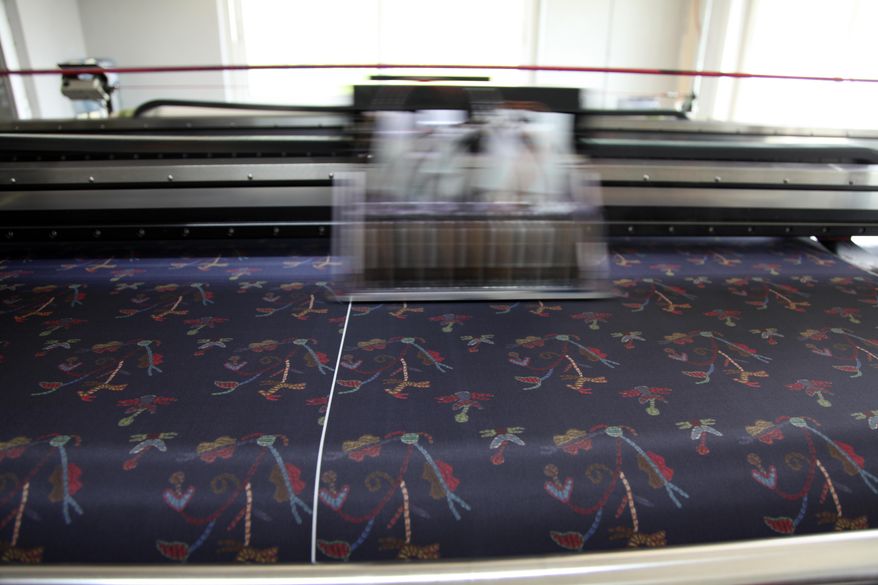 In this Tuesday, Sept. 10, 2019, a silk digital printing machine operates at Silk Tsiakiris Company in Soufli, northeastern Greece. Greece's financial crisis nearly snuffed out the country's centuries-old silk manufacturing tradition, but the end of the crippling recession has raised demand for fashion products and silk produced by a remote border town. (AP Photo/Iliana Mier)