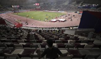 The stadium is sparsely filled for the second session at the World Athletics Championships in Doha, Qatar, Saturday, Sept. 28, 2019. (AP Photo/Nariman El-Mofty)