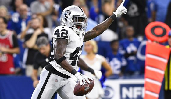 Oakland Raiders free safety Karl Joseph (42) celebrates a fumble recovery against the Indianapolis Colts during the first half of an NFL football game in Indianapolis, Sunday, Sept. 29, 2019. (AP Photo/Doug McSchooler)